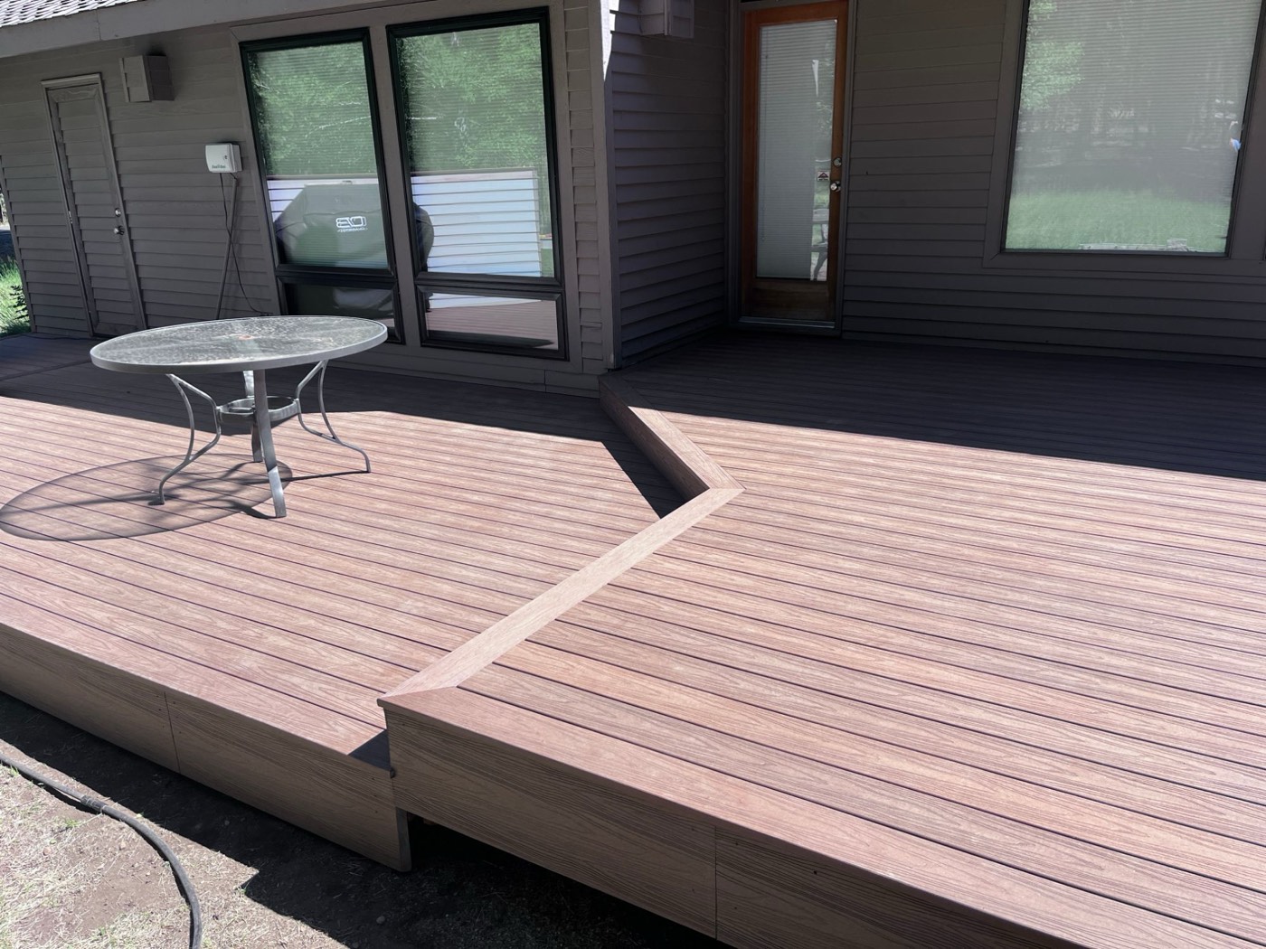 Angled step-down between deck levels with a mitered border board