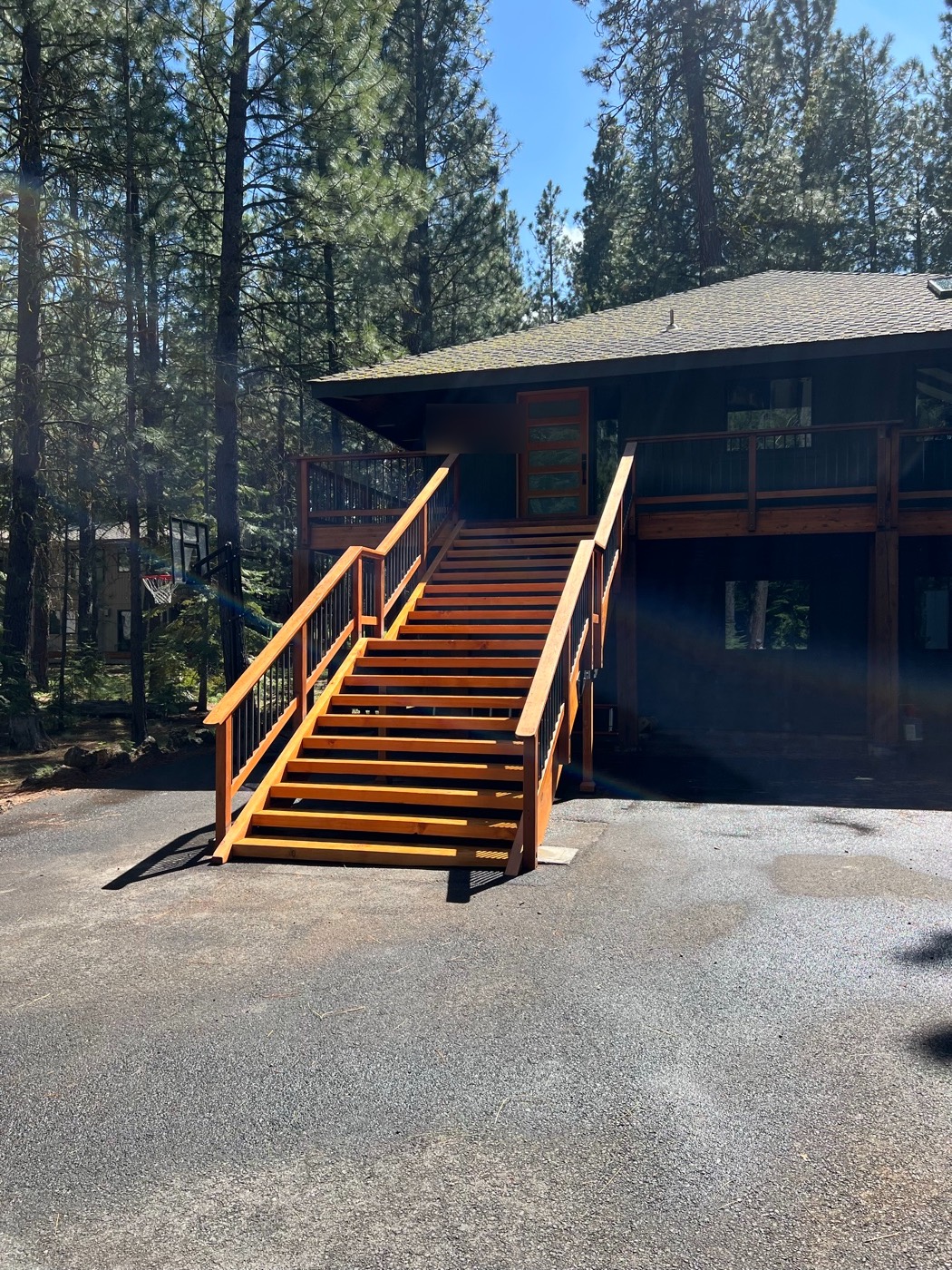 Full-height staircase from the driveway up to the main-level entry